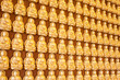 gold buddha doll on the hard wood.