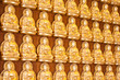 gold buddha doll on the hard wood.
