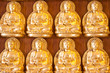 gold buddha doll on the hard wood.