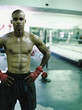 African boxer standing in gymnasium