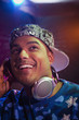Hispanic dj listening to headphones