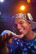 Hispanic dj in headphones pointing
