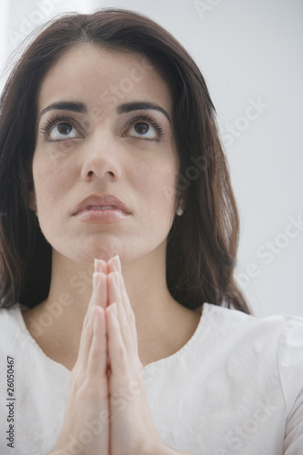 Photo: Hispanic woman praying Hispanic woman praying