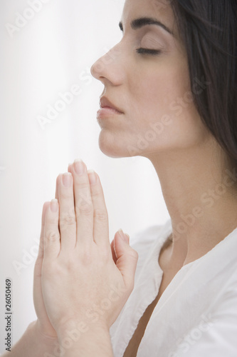 Photo: Hispanic woman praying Hispanic woman praying