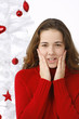 Beautiful young woman next to christmas tree on white background