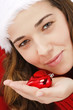 Beautiful young woman wearing santa hat