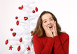 Beautiful young woman next to christmas tree