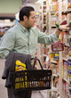 Hispanic man shopping in grocery store