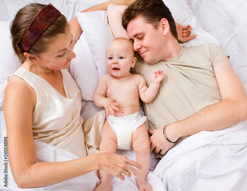 Photo: Lovely family in bed Lovely family in bed