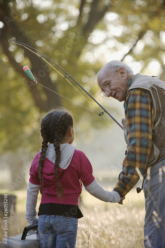 Photo: Hispanic man going fishing with granddaughter Hispanic man going fishing with granddaughter