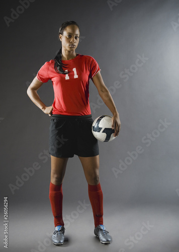 Photo: Mixed race soccer player holding soccer ball Mixed race soccer player holding soccer ball