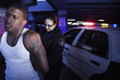 Policewoman handcuffing man