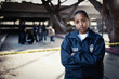 African policewoman standing outside crime scene