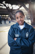 African policewoman smiling with arms crossed