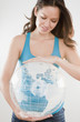 Mixed race woman holding inflatable globe