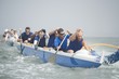 Outrigger canoeing team on water