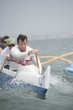 Outrigger canoeing team on water