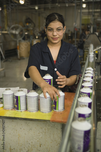 Photo: Hispanic woman working in manufacturing plant Hispanic woman working in manufacturing plant