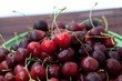 cherry in plate on a bamboo mat