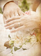 Vintage card with hands and rings on bridal bouquet
