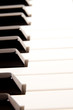 Close-up of a electronic piano keyboard on white