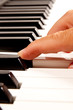 Close-up of a electronic piano keyboard on white