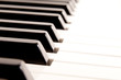 Close-up of a electronic piano keyboard on white