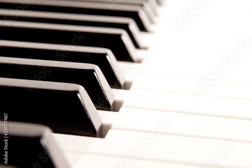 Photo: Close-up of a electronic piano keyboard on white Close-up of a electronic piano keyboard on white