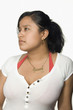 Hispanic woman looking pensive