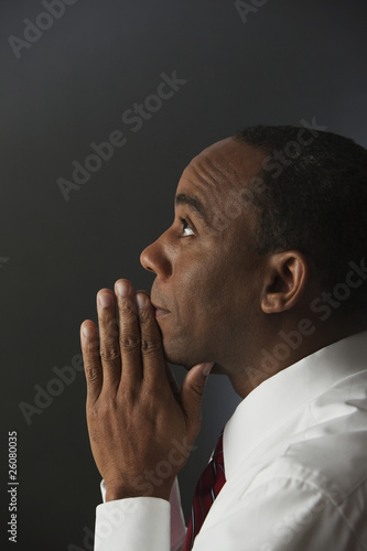 Photo: African businessman praying African businessman praying