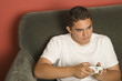 Hispanic teenager playing video game