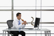 Pacific Islander businessman charming snake
