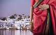 Indian woman in traditional clothing on waterfront