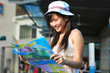 Little Chinese Asian Tourist Girl looking at her map Little Chinese Asian Tourist Girl looking at her map