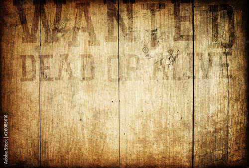 Photo: Old western wanted sign on wooden wall. Old western wanted sign on wooden wall.