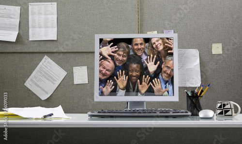 Foto: Business people trapped in computer monitor Business people trapped in computer monitor