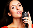 Jazz singer - Young woman singing in a old fashioned microphone