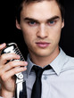 Famous young male jazz singer with a old microphone