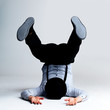 Crazy young guy on floor in a weird position