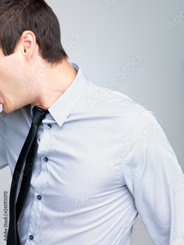 Photo: Cropped image of a young male business executive Cropped image of a young male business executive