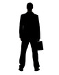 Young business man standing with briefcase