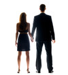 Rear view of a young couple holding their hands