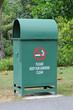 Photo: Green Color Rubbish Bin In The park Green Color Rubbish Bin In The park