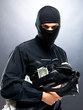 Sneaky thief holding a bag full of money