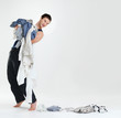 Photo: Bachelor life - Young man doing laundry Bachelor life - Young man doing laundry