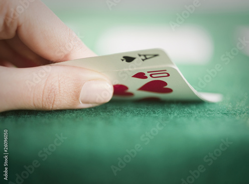 Photo: Hand revealing poker cards Hand revealing poker cards