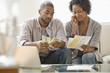 Photo: Black couple paying bills Black couple paying bills