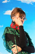 Beautiful young woman against the sky