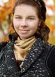 portrait of happy woman having relax in autumn park