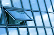 clouds in glazed panel skyscraper